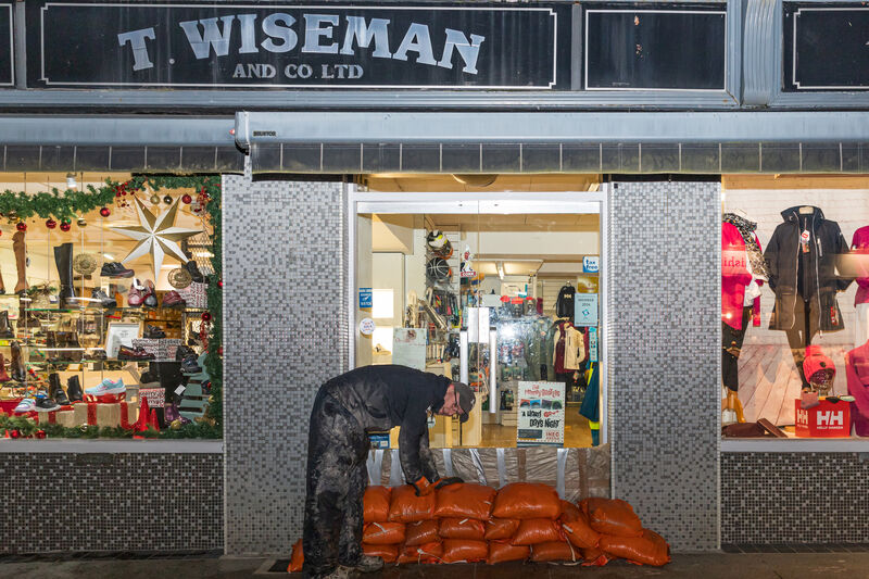 Gearoid Wiseman owner of Wiseman's Shoe shop prepares for the impending storm Bert in Bantry as he closes his shop this evening. Picture Anne Marie Cronin Photography Gearoid Wiseman owner of Wiseman's Shoe shop prepares for the impending storm Bert in Bantry as he closes his shop this evening. Picture Anne Marie Cronin Photography