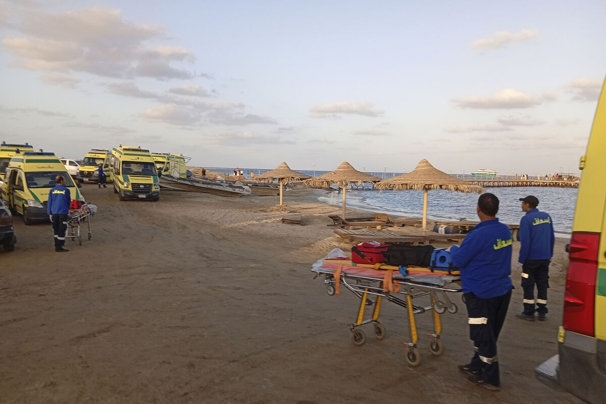 Rescuers wait on the beach of Marsa Alam, Egypt, on Monday after the tourist yacht sank in the Red Sea. Picture: AP