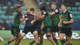 <p>IN THE THICK OF IT: Munster players Jack O'Donoghue and John Ryan tussle with Northampton Saints players, from left, Juarno Augustus, Lewis Ludlam and David Ribbans in 2022. Pic: Seb Daly/Sportsfile</p>