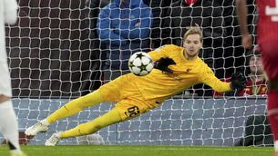<p>BIG MOMENT: Liverpool's goalkeeper Caoimhin Kelleher stops a penalty shot from Real Madrid's Kylian Mbappe. (AP Photo/Jon Super)</p>
