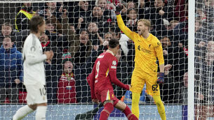 <p>PENALTY KING: Liverpool's goalkeeper Caoimhin Kelleher celebrates after stopping a penalty shot from Real Madrid's Kylian Mbappe. Pic: Jon Super/AP</p>