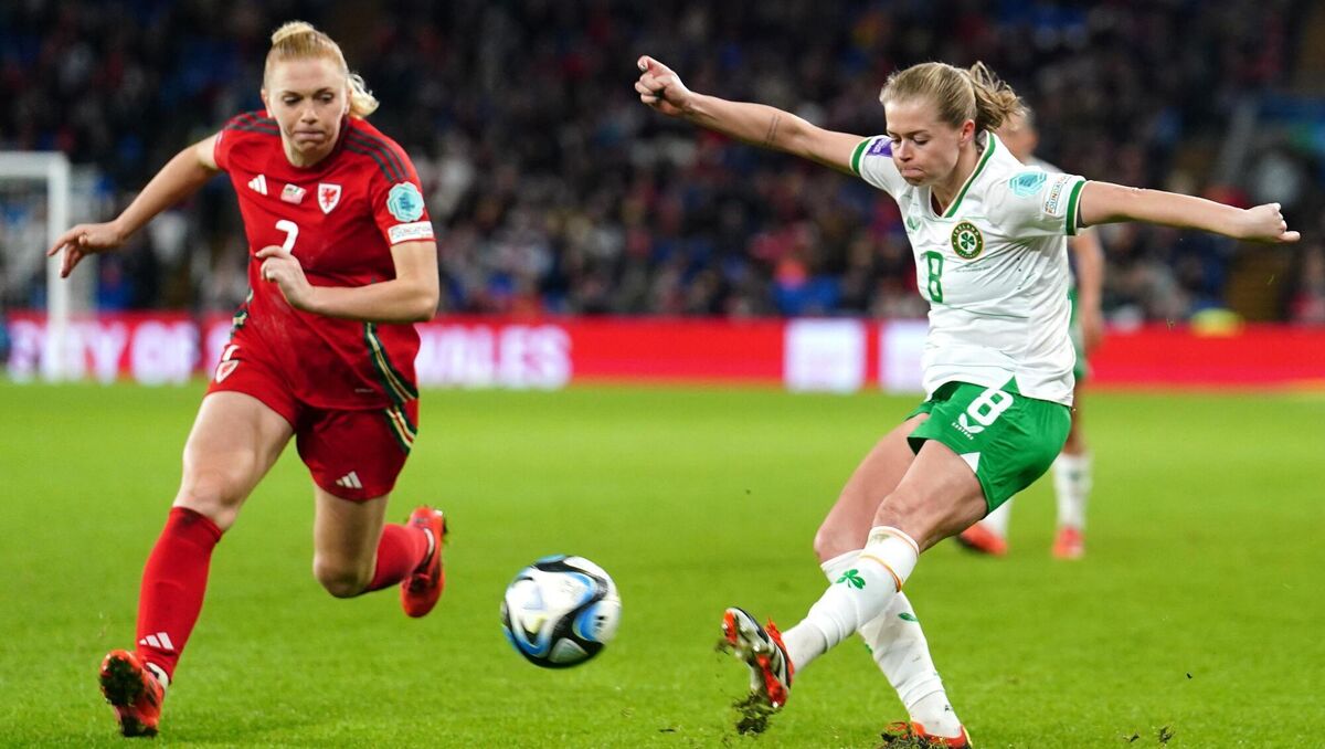 Republic of Ireland's player of the match Ruesha Littlejohn (right) crosses past Wales' Ceri Holland