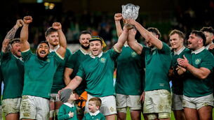 <p>PUSH ON: Ireland's Cian Healy, centre, after winning his record breaking 134th Ireland cap, lifts the Lansdowne Cup with captain Caelan Doris. Picture: Ramsey Cardy/Sportsfile</p>