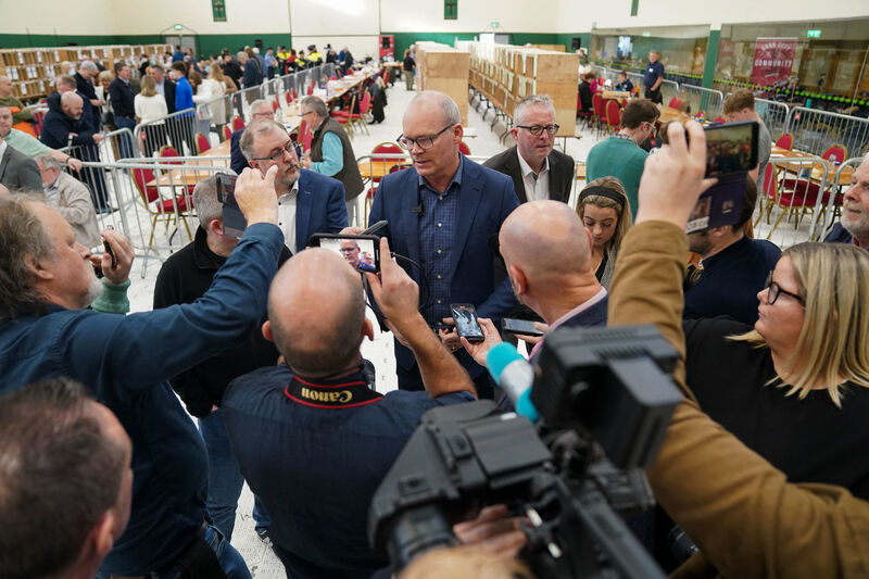 Simon Coveney speaks to media at Nemo Rangers GAA Club in Cork, as the vote count continues. Picture: Jacob King/PA Wire