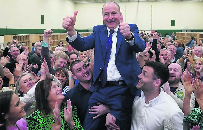 Fianna Fáil leader Micheál Martin is hoisted by sons Cillian and Micheal Aodh, on being elected in Cork South Centra at Nemo Rangers GAA Club. Fianna Fáil leader Micheál Martin is hoisted by sons Cillian and Micheal Aodh, on being elected in Cork South Centra at Nemo Rangers GAA Club.