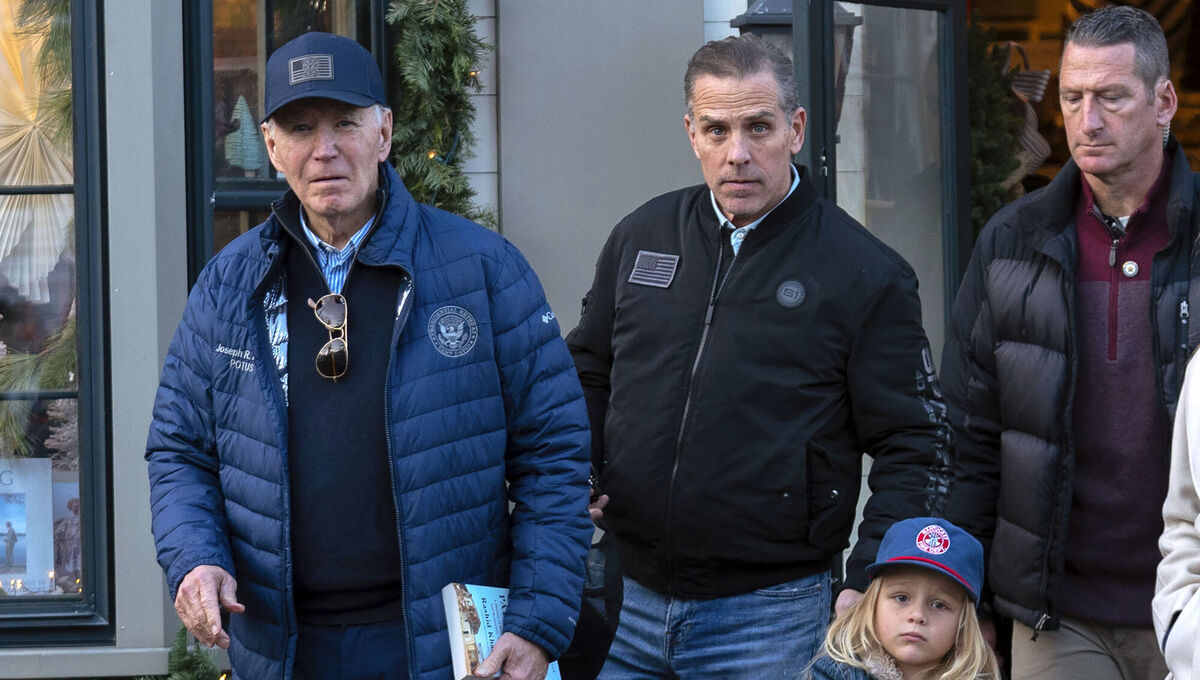 President Joe Biden accompanied by his son Hunter Biden and his grandson Beau leave a book store as they walk in downtown Nantucket Mass., Friday, Nov. 29, 2024. (AP Photo/Jose Luis Magana)