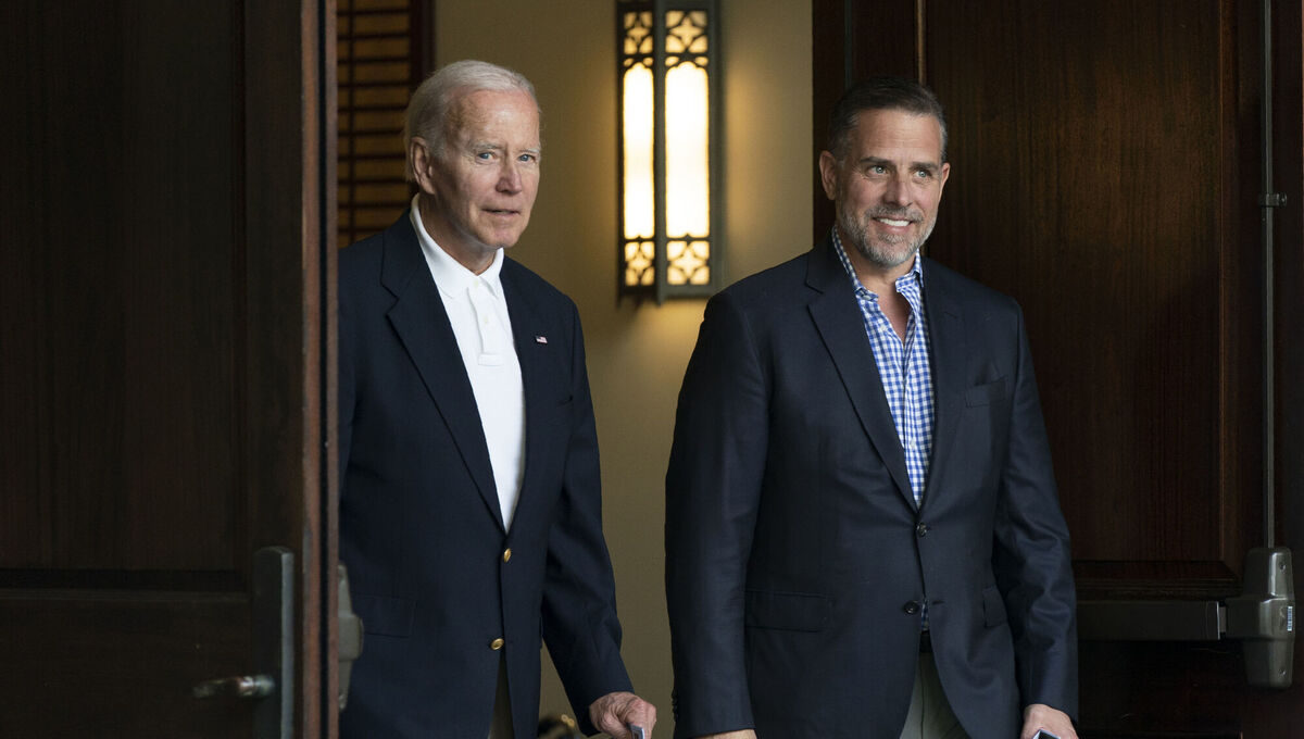 President Joe Biden and his son Hunter Biden leave Holy Spirit Catholic Church in Johns Island, S.C., after attending a Mass, Saturday, Aug. 13, 2022. Biden is in Kiawah Island with his family on vacation. (AP Photo/Manuel Balce Ceneta)