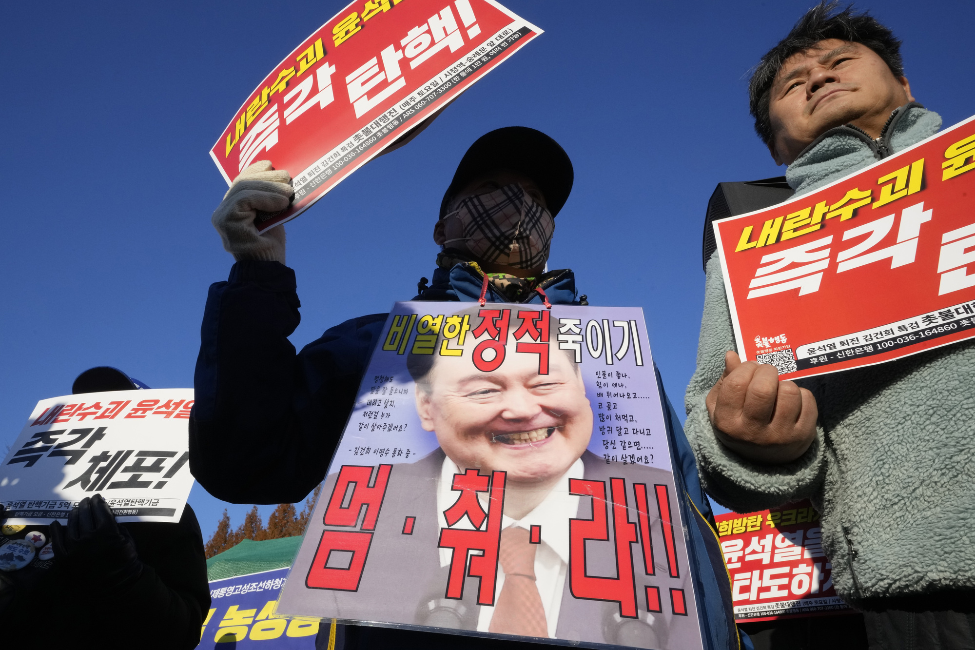 South Korea’s leader urged to resign or face impeachment over martial law decree
