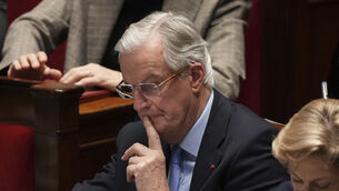 French Prime Minister Michel Barnier listens to speeches at the National Assembly prior to a no-confidence (AP Photo/Michel Euler)