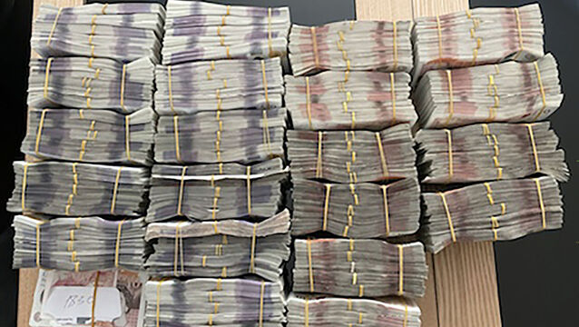 <p>Bundles of banknotes seized by Britain's National Crime Agency as it and other international agencies brought down a multibillion-dollar money laundering network run by two Russian millionaires. Picture: National Crime Agency/PA</p>