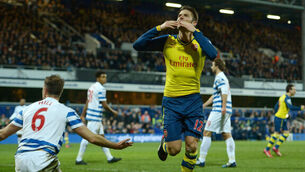 Arsenal hold on for win at QPR