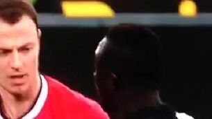 WATCH: Evans and Cisse spit at each other during game