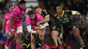 <p>FORTUNATE TIMING: Stade Francais' South African centre Jeremy Ward is tackled by La Rochelle's Tawera Kerr-Barlow. Pic: Xavier Leoty/AFP via Getty Images</p>