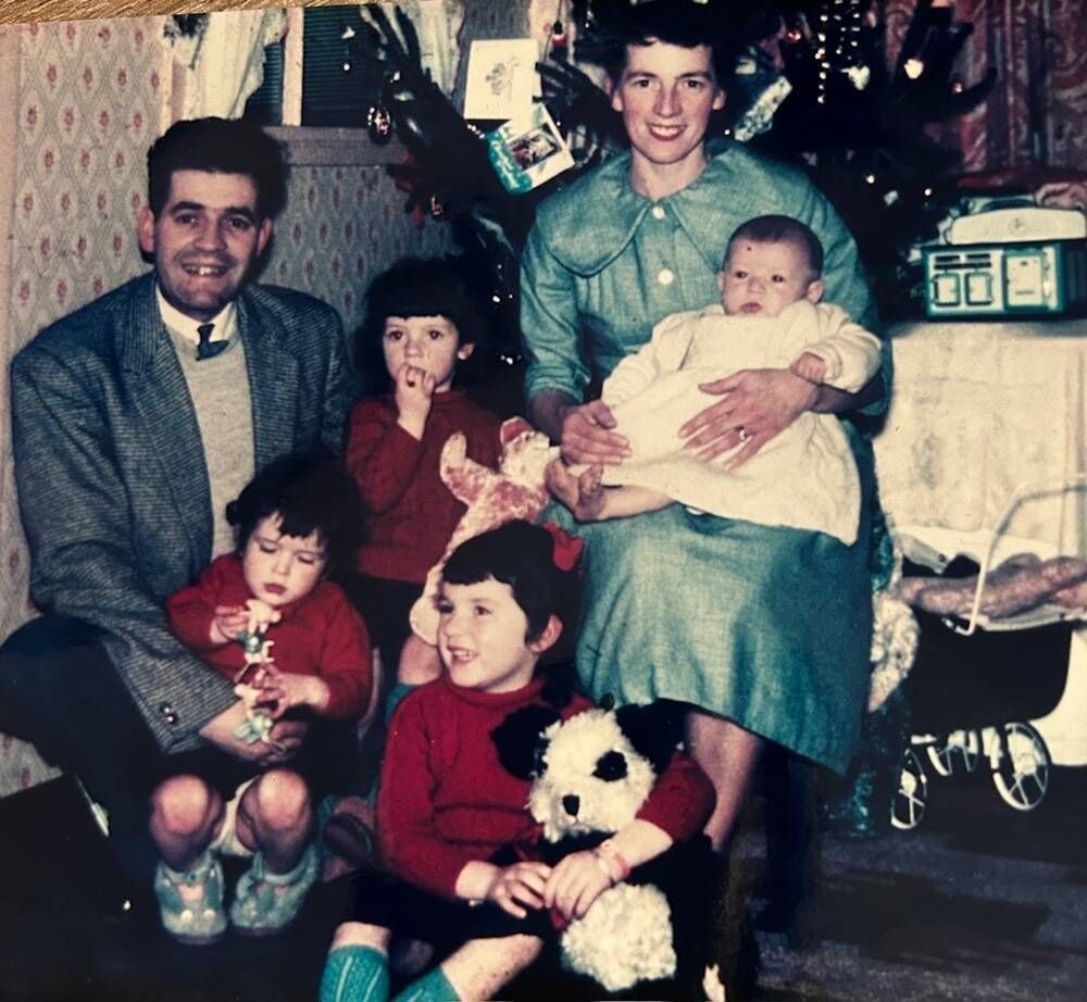 Billy and Maureen Lehane with their four daughters, Helen, Mary, Liz, and Ursula, on Christmas Day 1959. 'They are like the best jewels, like diamonds in a crown. We couldn’t have asked for more,' says Maureen.