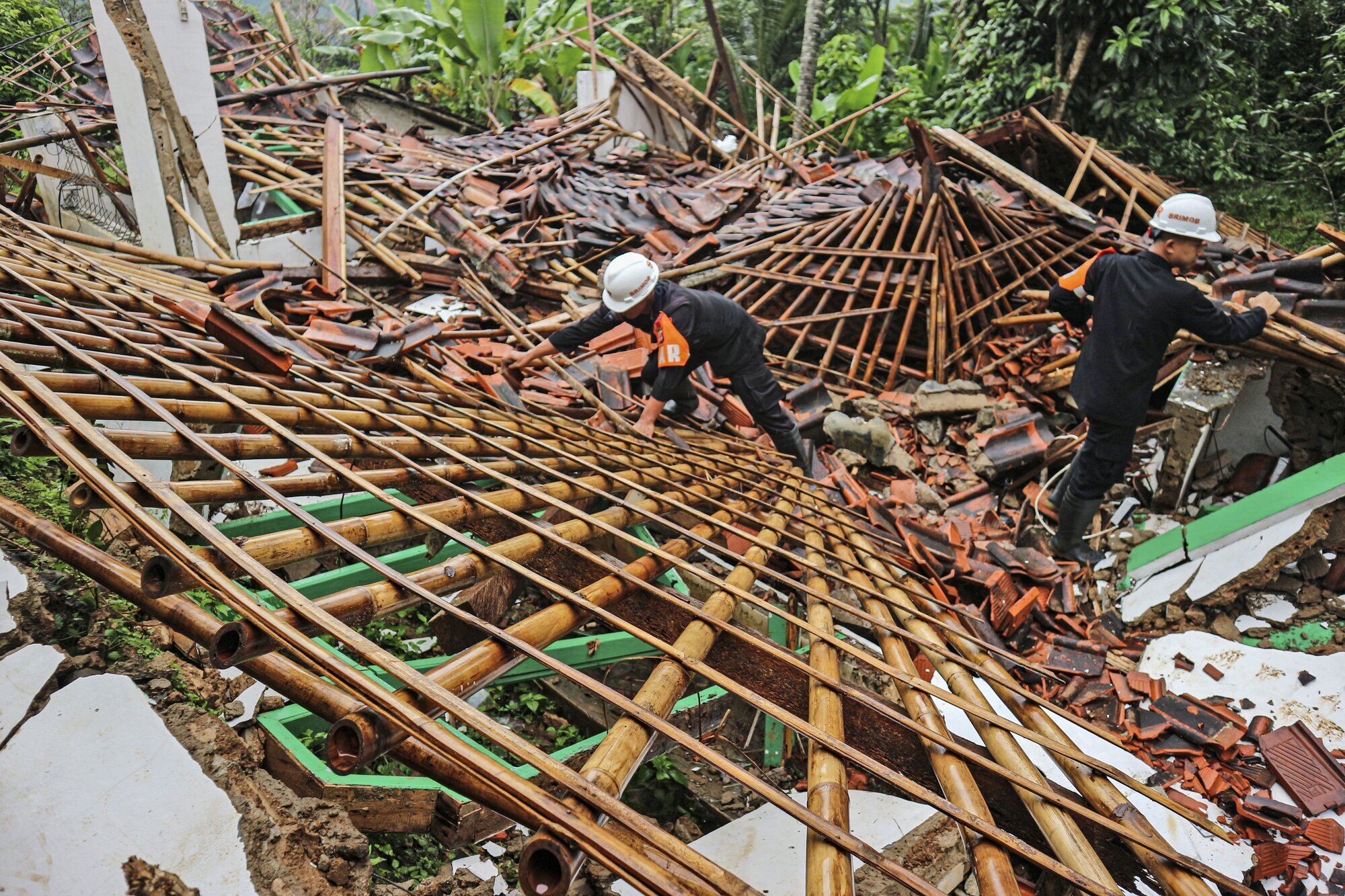 Ten bodies recovered after flash floods hit Indonesian villages
