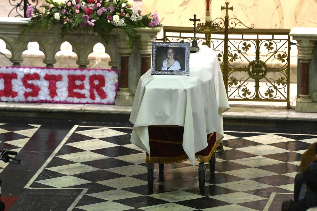 Floral tributes spelling out the words sister, mam and aunt, were placed at the altar. Picture: Larry Cummins