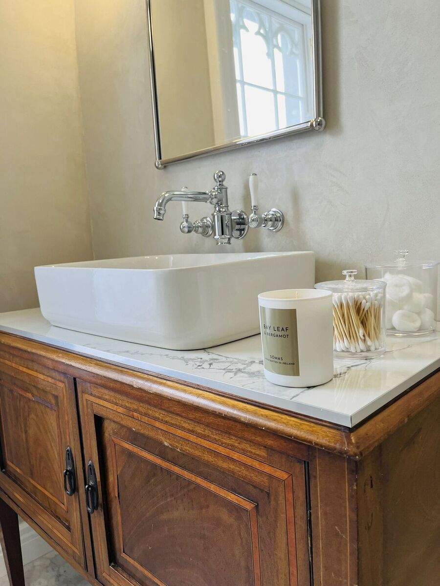  Rob Hennessy has opted for a blend of contemporary an vintage in his en-suite bathroom with micro-cement walls instead of tiles and a vintage sink unit.