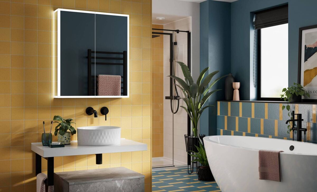 Half-tile and full-tile used beautifully over a large area of stunning colour in paint and porcelain, the Sound Bathroom mirror cabinet, €992, Deluxe Bathrooms.