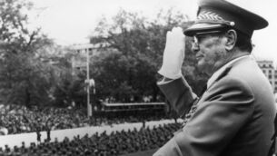 <p>IRON WILL: Yugoslav statesman and president, Marshal Tito salutes as troops march past at a military parade at Belgrade to mark the 30th anniversary of liberation. </p>