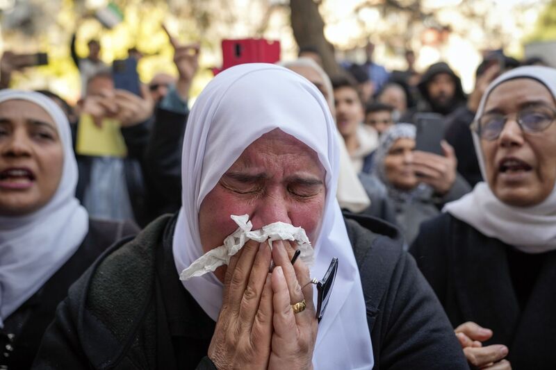 Mourners weep during the funeral of Syrian activist Mazen al-Hamada in Damascus on Thursday after his mangled corpse was found wrapped in a bloody sheet in Saydnaya prison. It may well prove to one of the last acts of savagery by the Assad regime that ruled Syrian for half a century. Picture: Hussein Malla/AP Mourners weep during the funeral of Syrian activist Mazen al-Hamada in Damascus on Thursday after his mangled corpse was found wrapped in a bloody sheet in Saydnaya prison. It may well prove to one of the last acts of savagery by the Assad regime that ruled Syrian for half a century. Picture: Hussein Malla/AP
