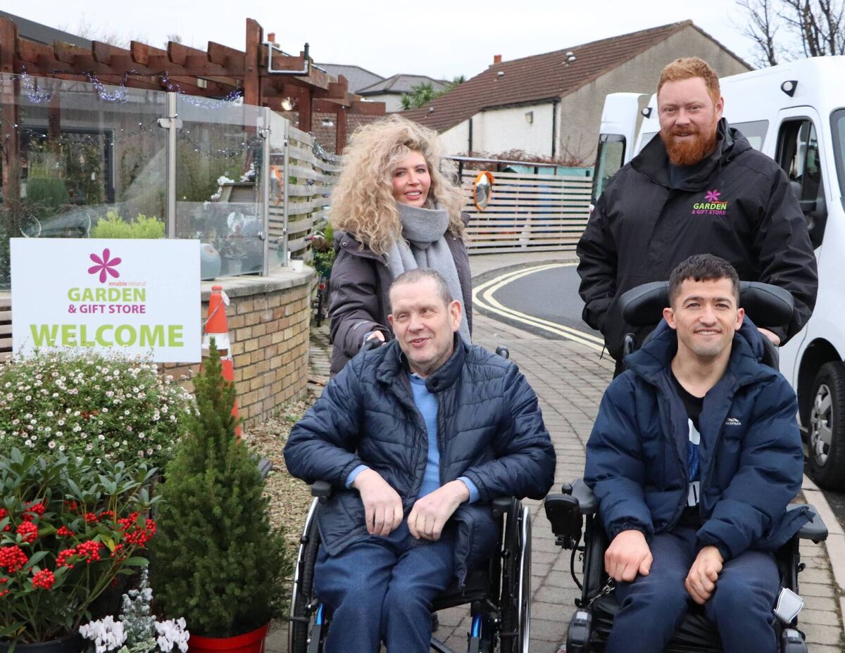 Aoife Doyle with Brian Murphy and Padhraic Mulcahy from Sandyford Adult Services collecting the keys for a new purpose-built made possible thanks to funds raised by customers who support the Enable Ireland Garden Centre and Gift Shop.