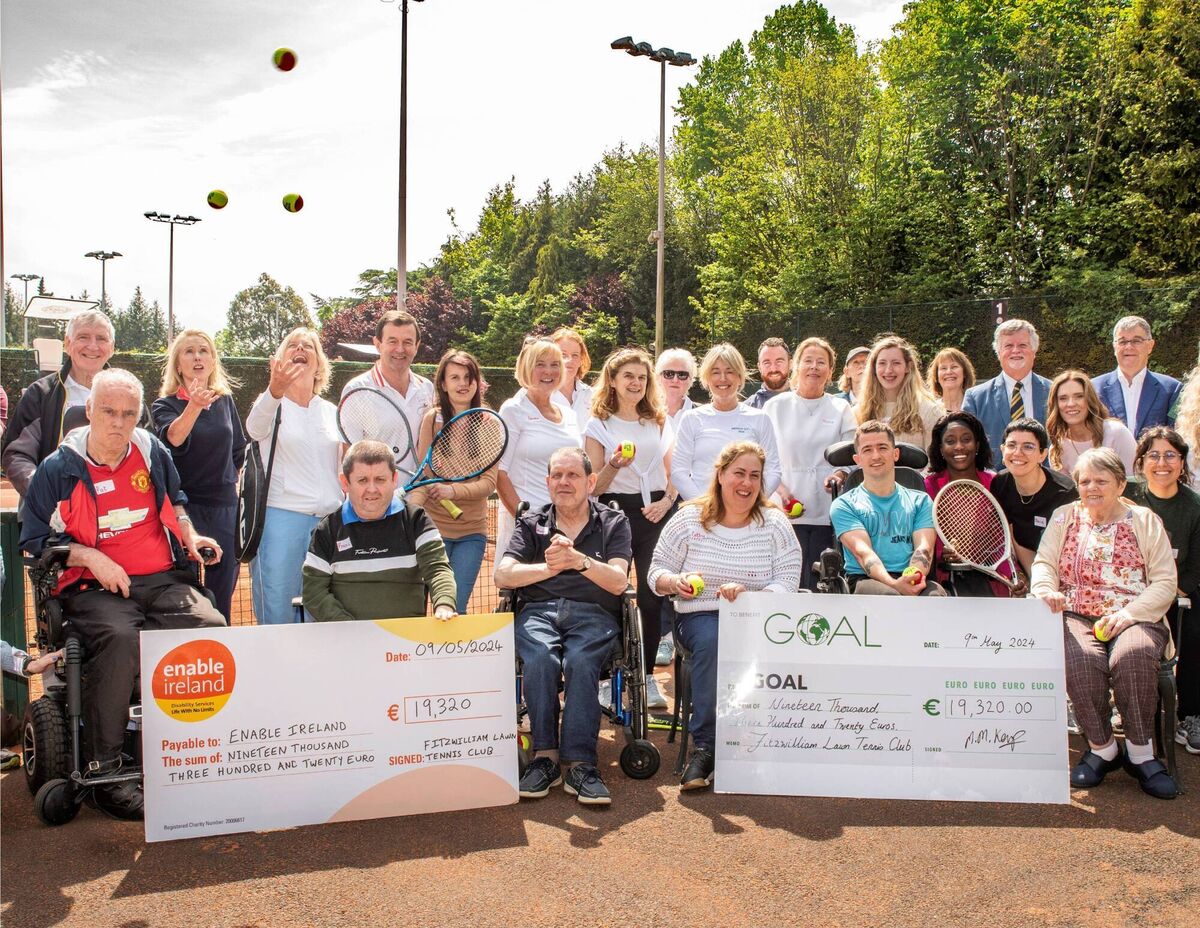 Staff and service owners from Enable Ireland Sandyford with volunteers from Fitzwilliam Tennis Club accepting a donation of nearly €20,000 to support services.