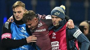 <p>Craig Casey of Munster is carried from the pitch with an injury during the Champions Cup Pool 3 match between Castres Olympique and Munster. Pic: Brendan Moran/Sportsfile</p>