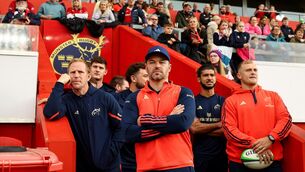 <p>Munster Attack Coach Mike Prendergast and Skills Coach Mossy Lawler watch the women’s game. Pic: ©INPHO/Ben Brady.</p>