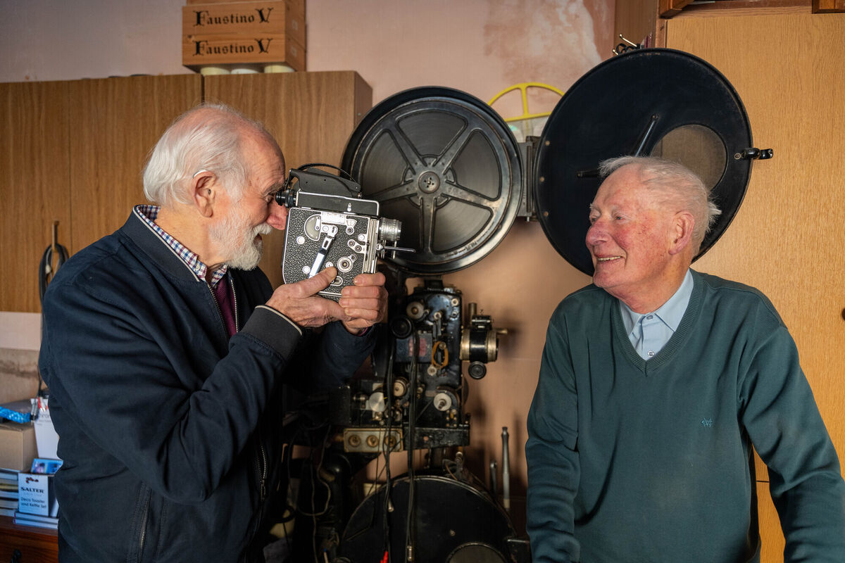 (Left to right) filmmakers Michael Mulcahy and John Lynch with a projector behind them that they bought from The Everyman Theatre in Cork to show films which John used to show in Ennis, Co Clare, in past summers. Picture: Noel Sweeney