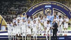 <p>CHAMPIONS: Real Madrid's players pose with the trophy at the end of the Intercontinental Cup final. Pic: AP Photo/Hussein Sayed.</p>