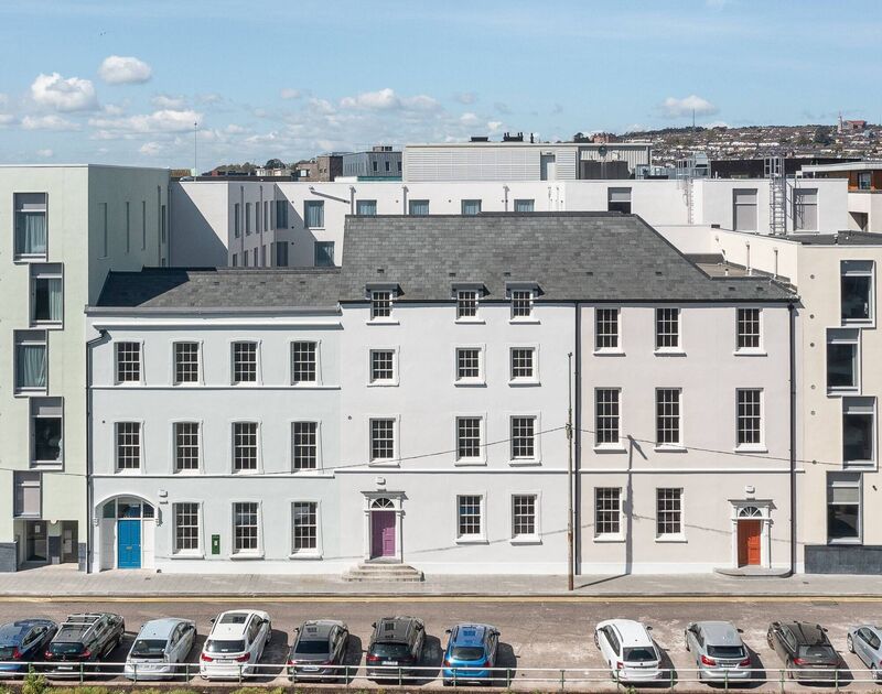 Three own-door office buildings are bookended by the Premier Inn on Morrison's Quay