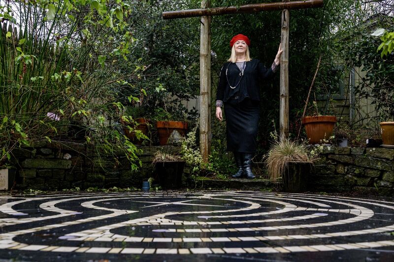 Shirley Gallagher's mosaic in her back yard has been made from fragments of her original kitchen and bathroom tiles. Picture: Chani Anderson