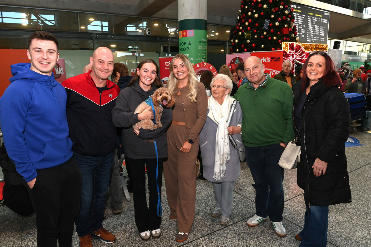 Kelly Matthews and Eve Mullins got a great welcome home from Dubai. (l to r) Colm Murphy, Jason Matthews, Kelly Matthews with dog Bear, Eve Mullins, grandmother Esther Buckley, Mick Mullins, and Fiona Matthews. Pictures: Larry Cummins