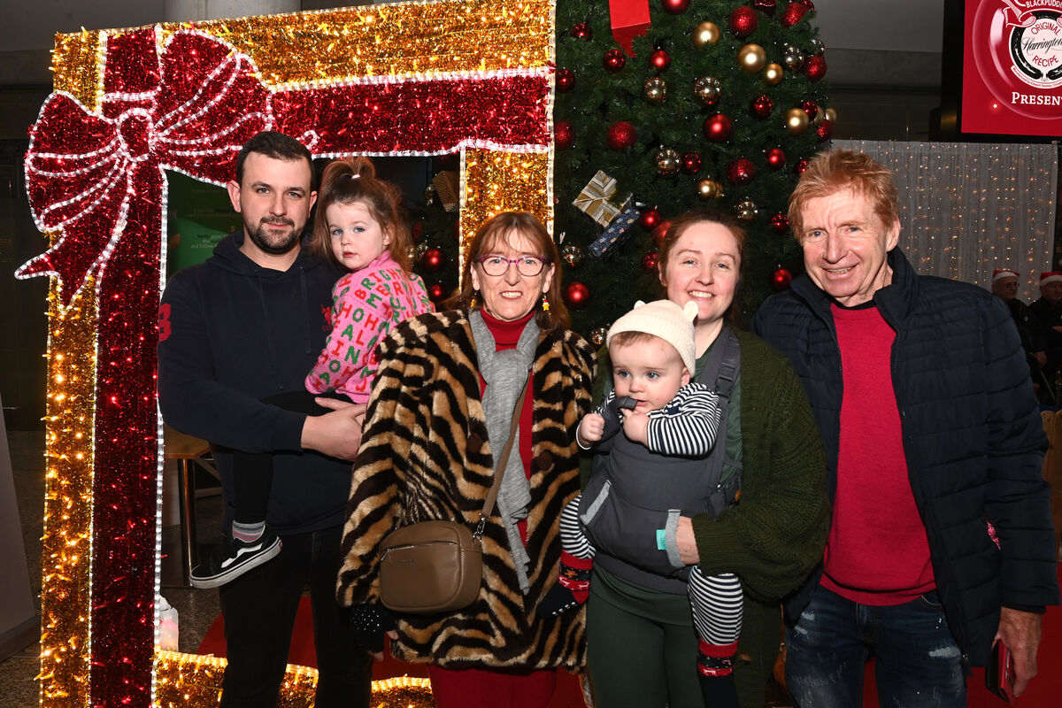 Mary and Frank Cashman, Aghada, welcoming home their daughter Sharon Goff with her husband George and children Aoife and Oisín at Cork Airport. Picture: Larry Cummins