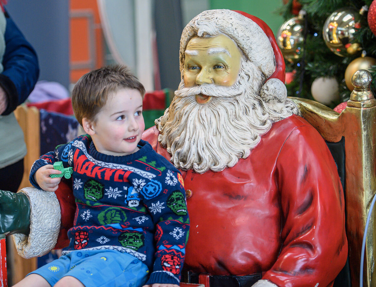  Young Ben Price, Manchester with Santa Claus at Cork Aiport after he flew into Cork Airport to visit his grandparents in Dromina. Picture Dan Linehan