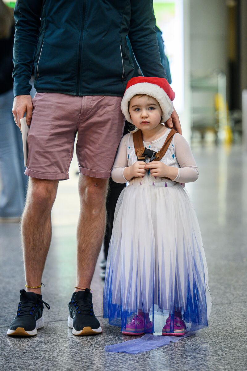  Three-year-old Cora Kelly waiting patiently at Cork Airport to meet her grandmother Sue Hopwood...