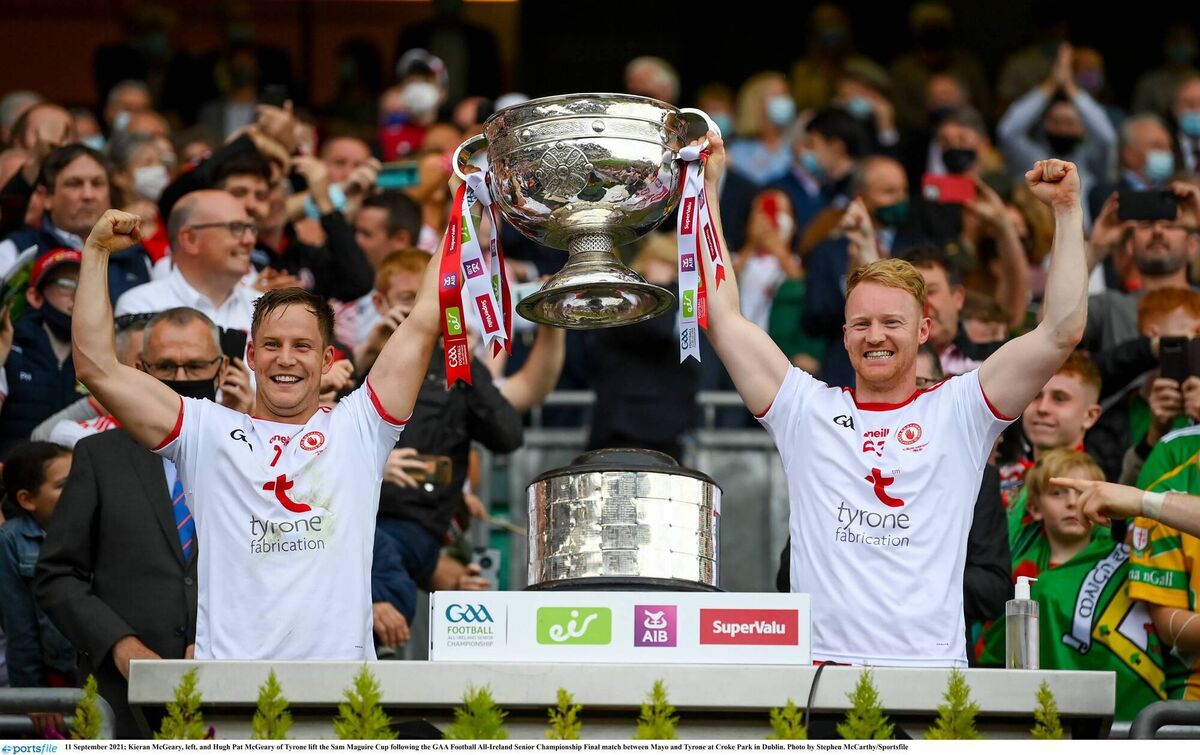 Kieran McGeary, left, and Hugh Pat McGeary of Tyrone lift the Sam Maguire Cup following the 2021 All-Ireland SFC final against Mayo. Photo by Stephen McCarthy/Sportsfile