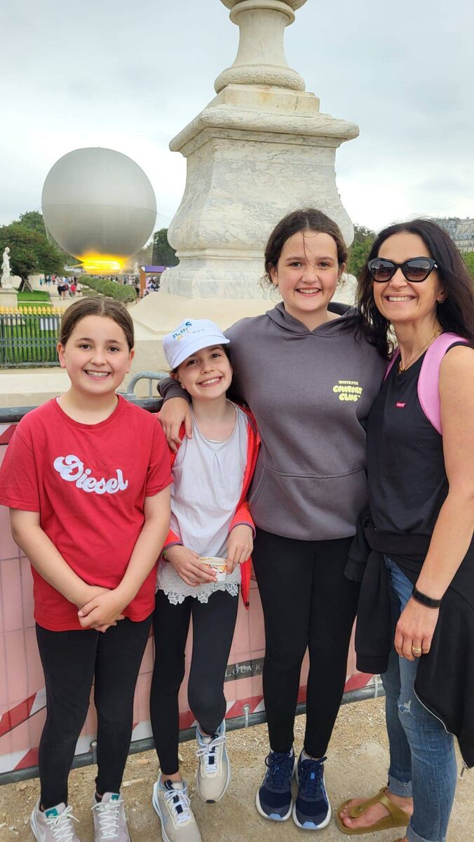 Natalie, Ruby and Lana Ryan with their mum Vickie Maye at the Olympic Flame in Paris. Natalie, Ruby and Lana Ryan with their mum Vickie Maye at the Olympic Flame in Paris.