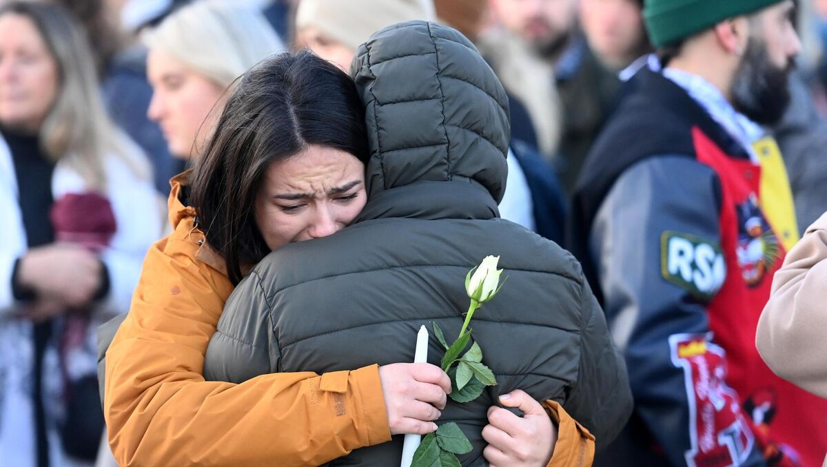 Family and friends of Bruna comfort each other at the vigil for Bruna at the Lough in Cork in January 2023. Picture: Larry Cummins Family and friends of Bruna comfort each other at the vigil for Bruna at the Lough in Cork in January 2023. Picture: Larry Cummins