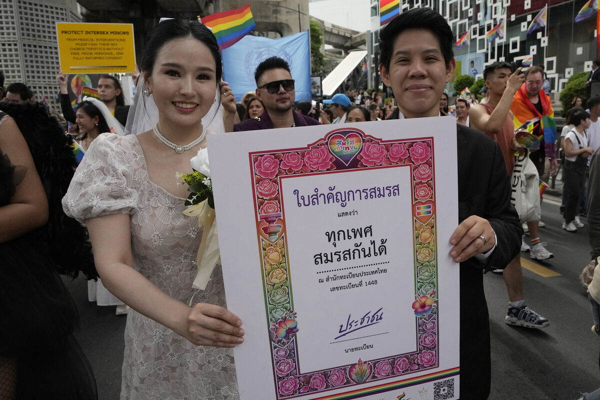 Participants hold posters celebrating equality in marriage during the Pride Parade in Bangkok. Picture: AP Photo/Sakchai Lalit, File Participants hold posters celebrating equality in marriage during the Pride Parade in Bangkok. Picture: AP Photo/Sakchai Lalit, File