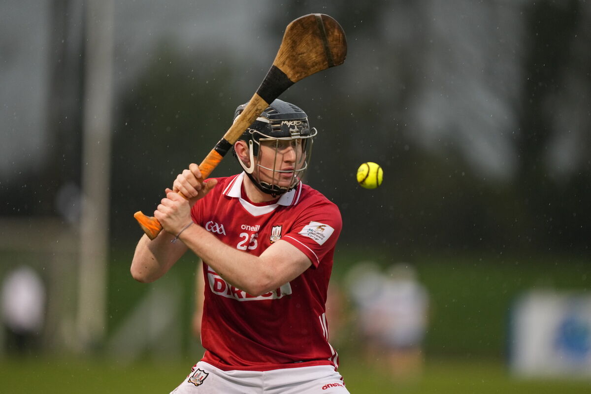 Cork's Jack Cahalane strikes a point for Cork. Cork's Jack Cahalane strikes a point for Cork.