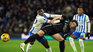 <p>MIDFIELD TUSSLE: Brighton and Hove Albion's Carlos Baleba (left) and Arsenal's Declan Rice battle for the ball. Pic: Jonathan Brady/PA Wire.</p>