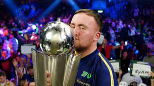 <p>Luke Littler kisses The Sid Waddell Trophy after winning the Paddy Power World Darts Championship final against Michael van Gerwen at Alexandra Palace, London. Picture: Zac Goodwin/PA Wire. </p>