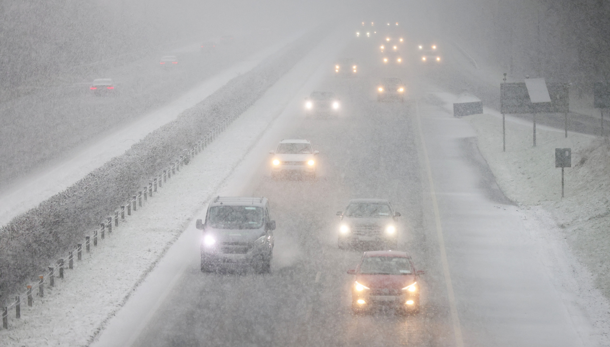 Difficult driving conditions for motorists heading south on Sunday, as heavy snow falls on the M7 motorway in Kildare. Picture: Eamonn Farrell / © RollingNews.ie