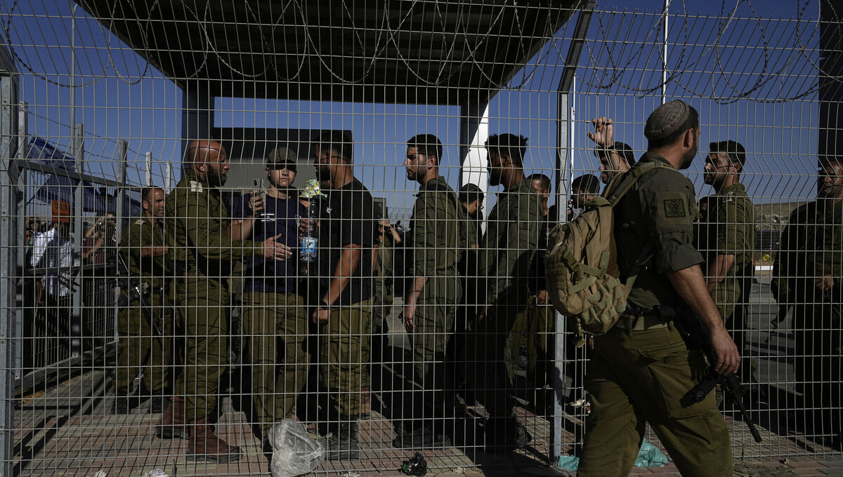 Israeli soldiers gather at the gate to the Sde Teiman military base, where soldiers are being questioned for detainee abuse on  Monday, July 29, 2024. Picture: Tsafrir Abayov/AP