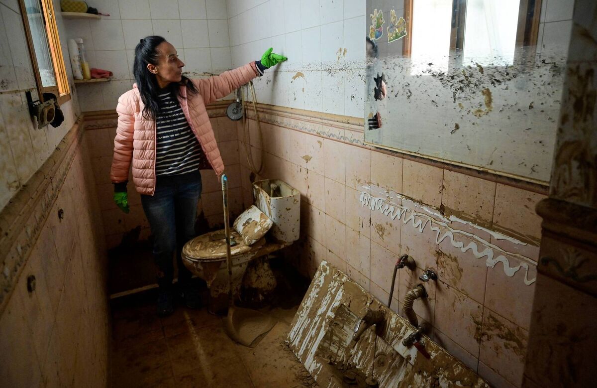 Mari Carmen Cuenca shows the damage to her house that has been completely destroyed by the floods in the aftermath of deadly flooding. Picture: Jose Jordan / AFP via Getty Images Mari Carmen Cuenca shows the damage to her house that has been completely destroyed by the floods in the aftermath of deadly flooding. Picture: Jose Jordan / AFP via Getty Images