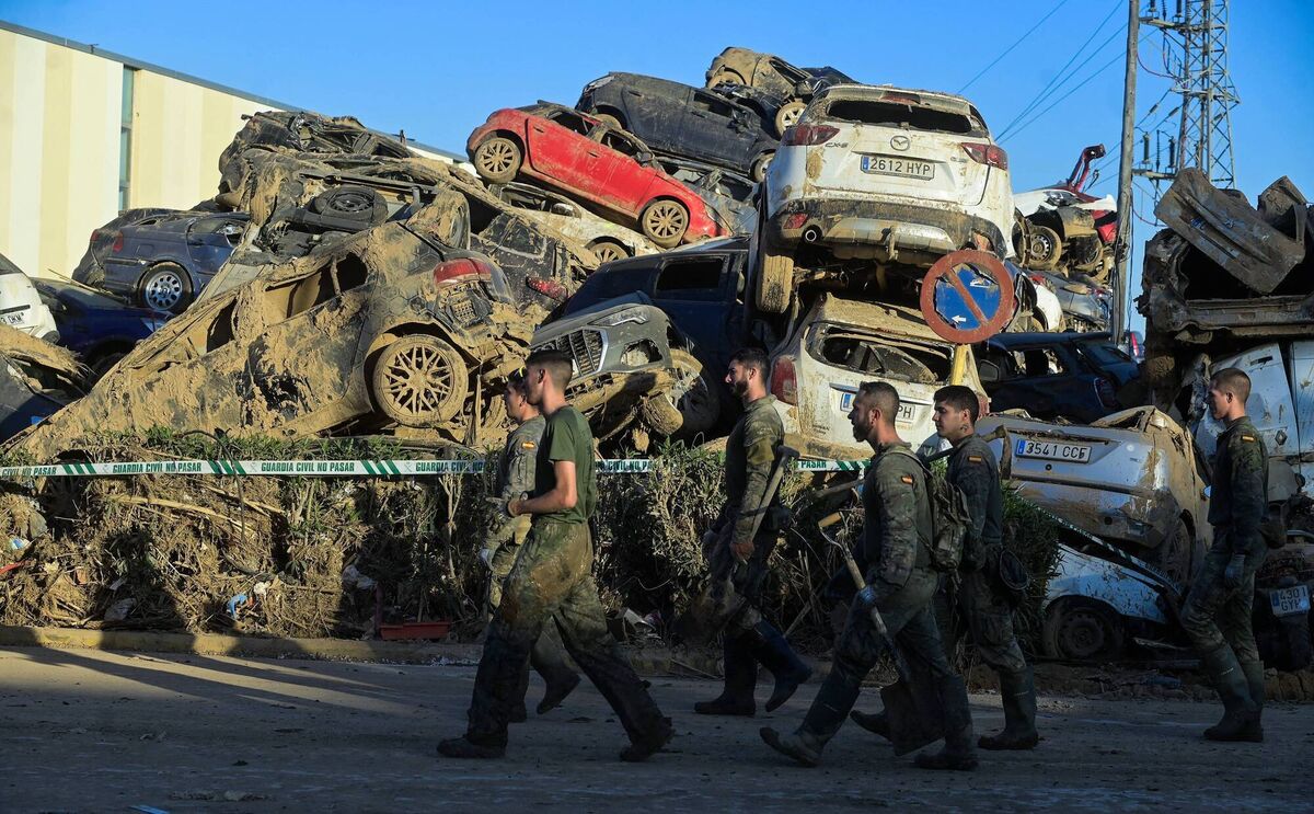 Soldiers walking next to a car graveyard in the aftermath of the flooding in Paiporta, near Valencia, eastern Spain, on November 27, 2024. Picture: José Jordan/AFP via Getty Images Soldiers walking next to a car graveyard in the aftermath of the flooding in Paiporta, near Valencia, eastern Spain, on November 27, 2024. Picture: José Jordan/AFP via Getty Images