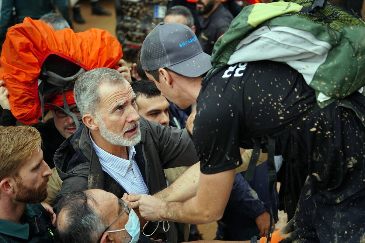 King Felipe VI of Spain, left, talks with a man as angry residents heckle him during his visit to Paiporta. Picture: Manaure Quintero /AFP via Getty Images King Felipe VI of Spain, left, talks with a man as angry residents heckle him during his visit to Paiporta. Picture: Manaure Quintero /AFP via Getty Images
