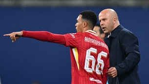 <p>PROTECTIVE ARM: Liverpool's Trent Alexander-Arnold (left) and manager Arne Slot. </p>