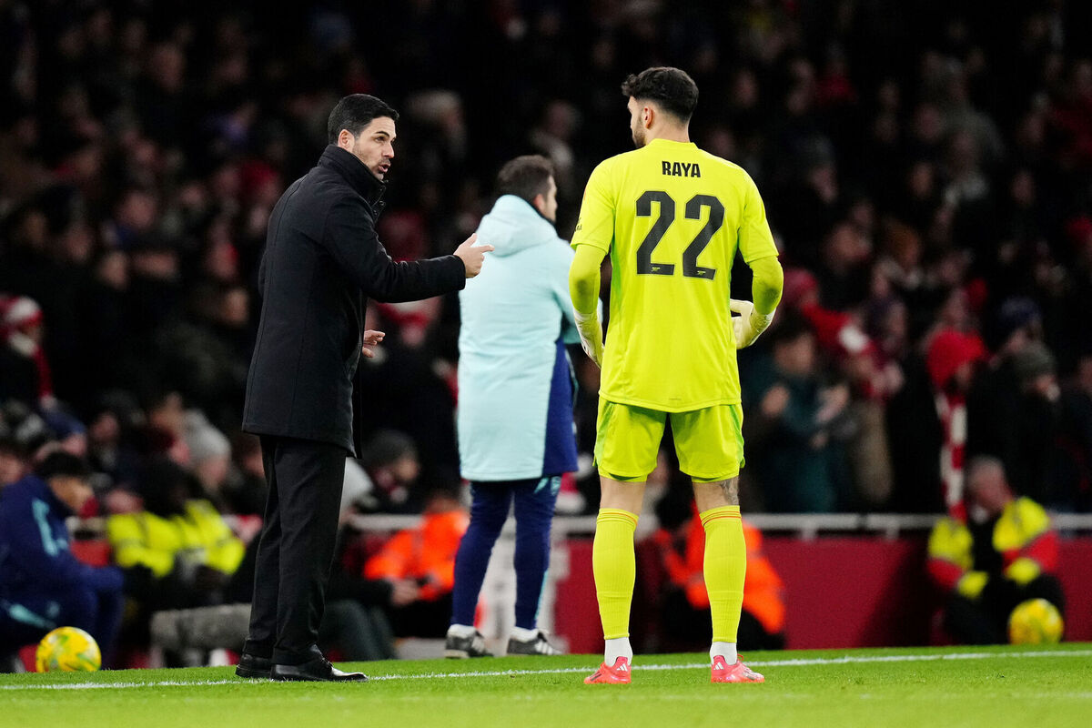 Arsenal manager Mikel Arteta (left) speaks to goalkeeper David Raya on the touchline during the Carabao Cup semi-final. Photo: John Walton/PA Wire. Arsenal manager Mikel Arteta (left) speaks to goalkeeper David Raya on the touchline during the Carabao Cup semi-final. Photo: John Walton/PA Wire.